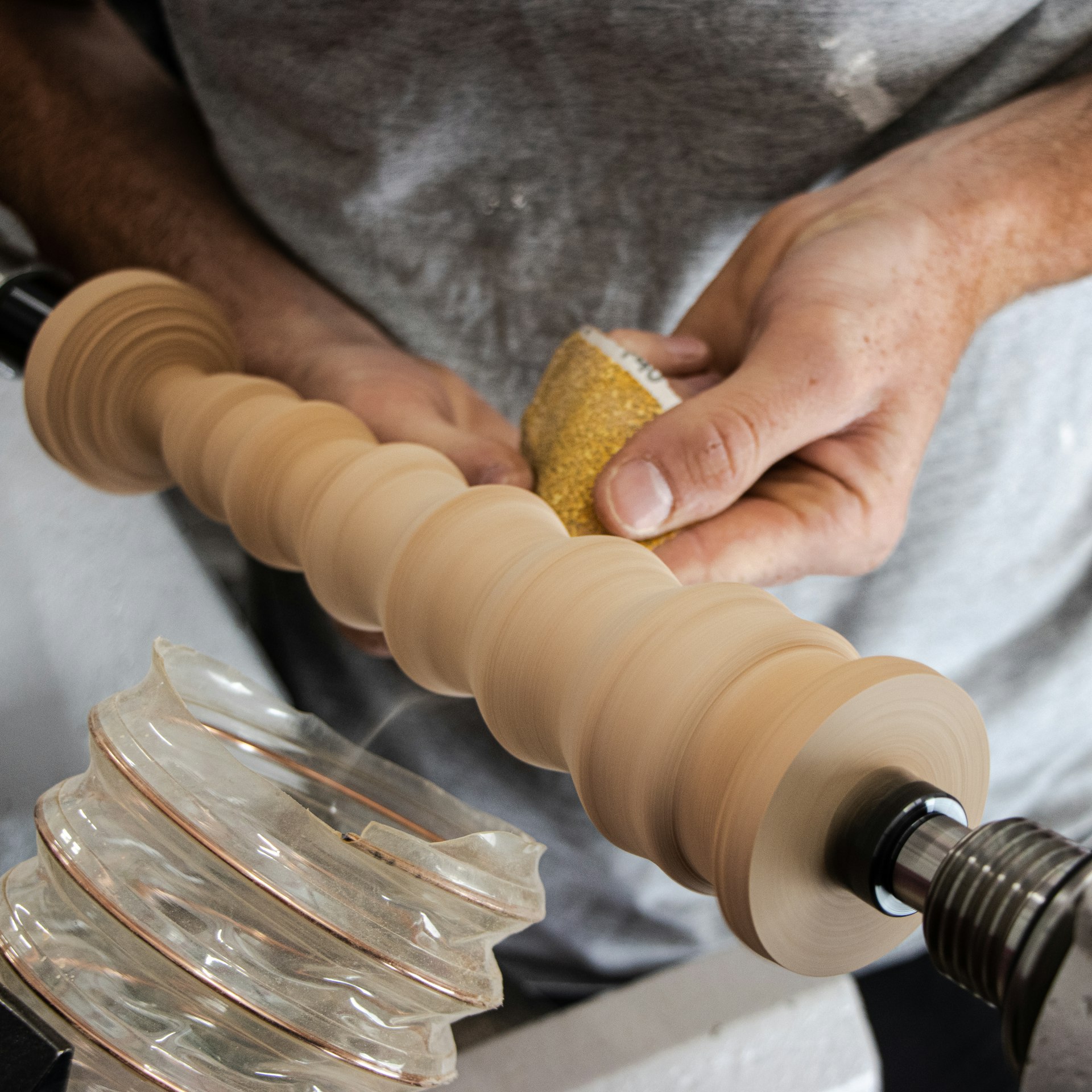 a man holding a piece of wood in his hands